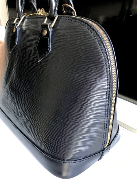 louis vuitton black alma bag.